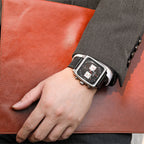 MEGIR 2182 men's chronograph watch on the wrist, silver square case with black dial and black leather strap