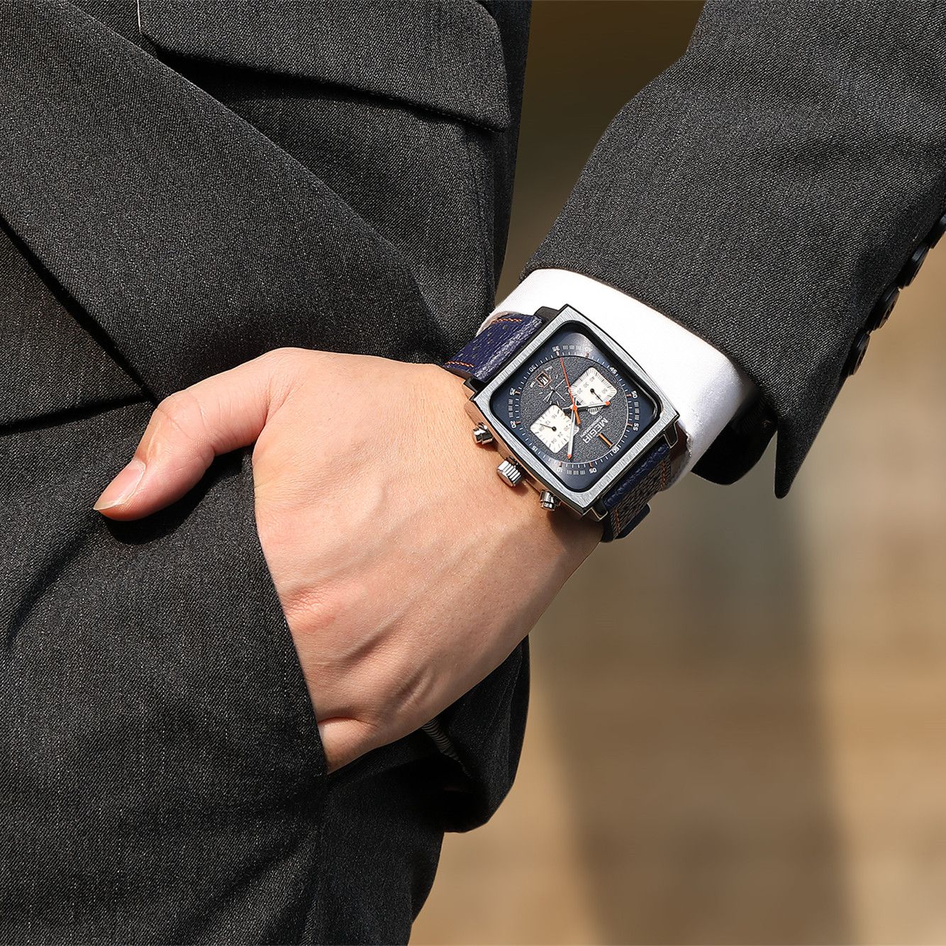MEGIR 2182 men's chronograph watch on the wrist, silver square case with blue dial and blue leather strap