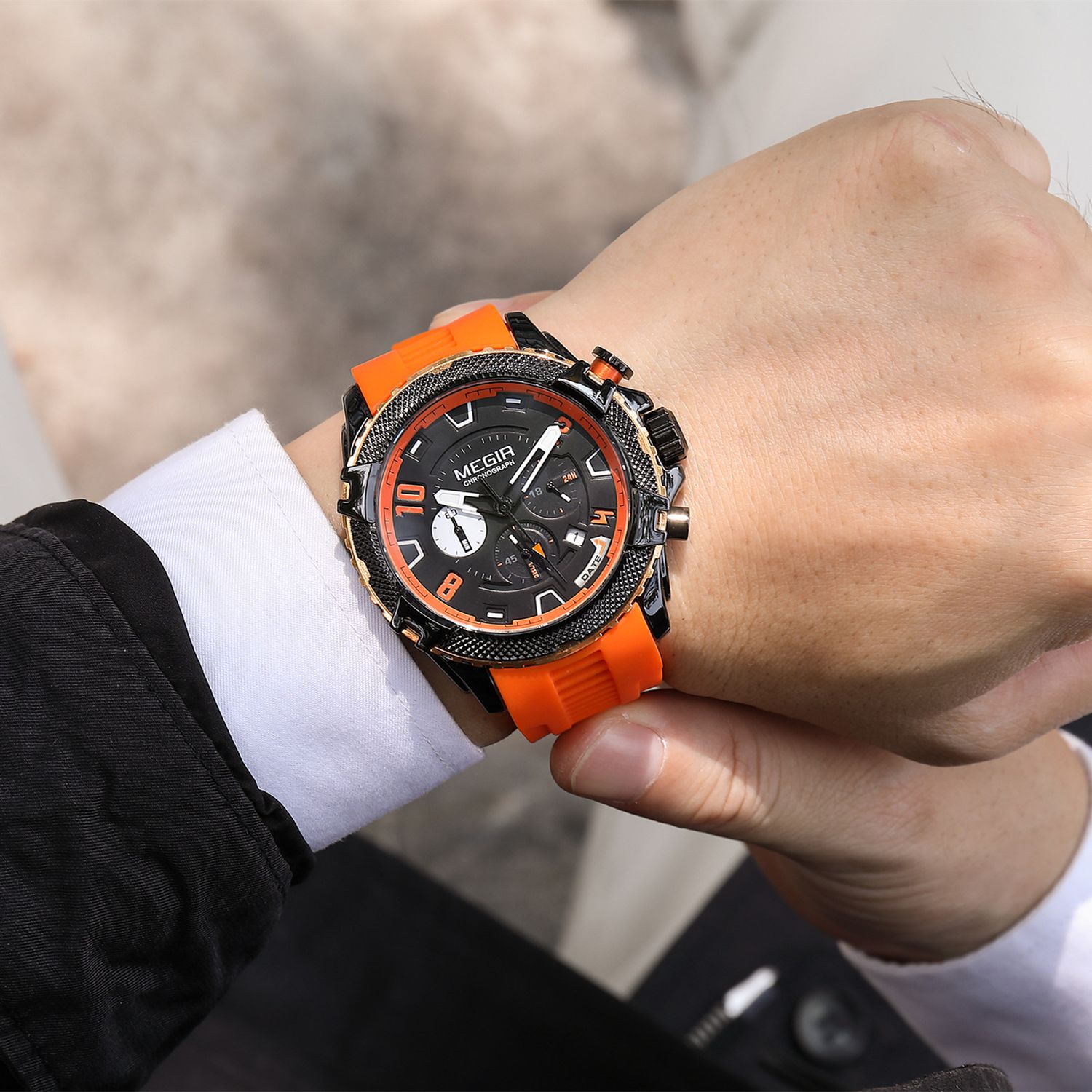 MEGIR 2200 men's chronograph watch on the wrist, black case with orange bezel and orange silicone strap
