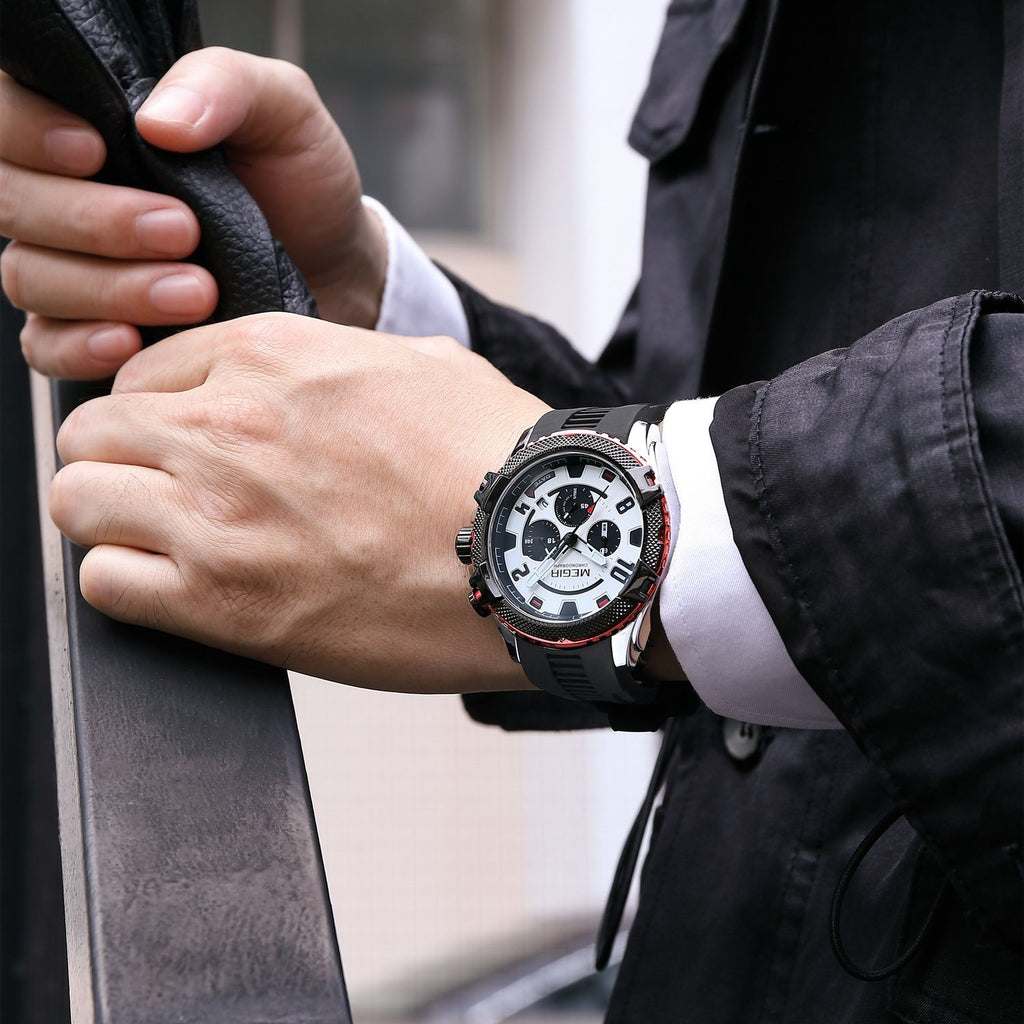 MEGIR 2200 men's chronograph watch on the wrist, silver case with red accents, white dial and black silicone strap