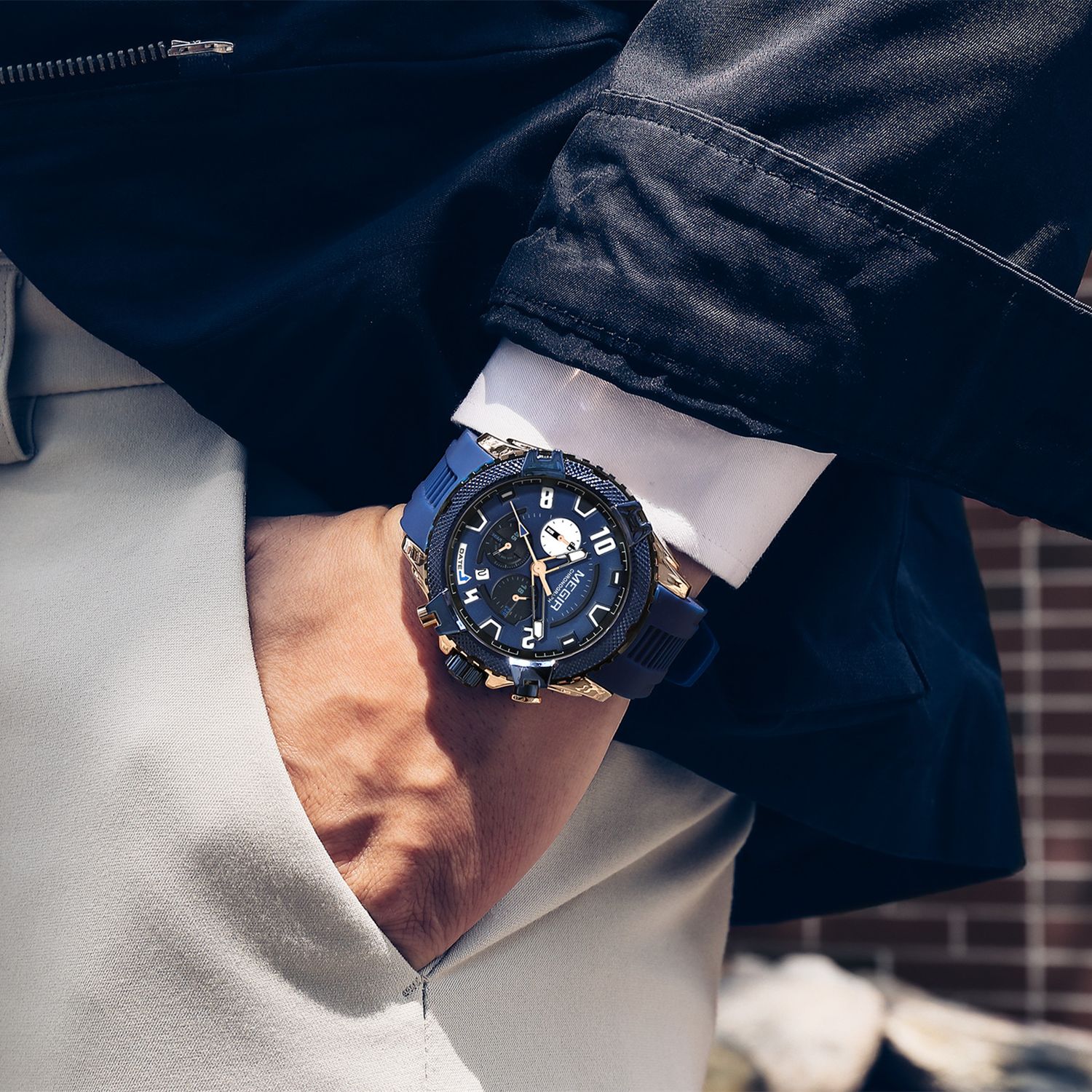 MEGIR 2200 men's chronograph watch on the wrist, rose-gold and blue case with blue dial and blue silicone strap