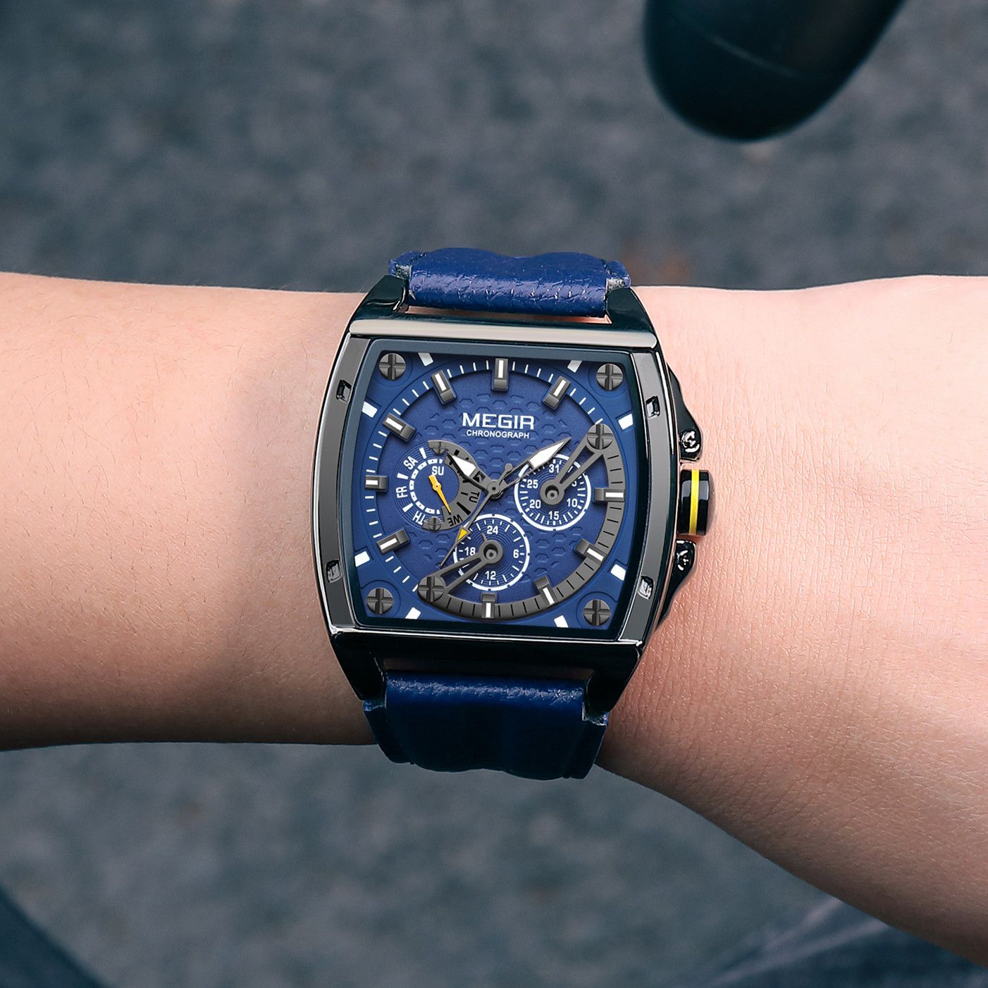 MEGIR 2204 men's chronograph watch on the wrist, black case with blue dial and blue leather strap