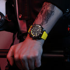 MEGIR 2209 men's chronograph watch on the wrist, black case with yellow skeleton dial and yellow silicone strap
