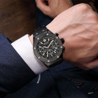 MEGIR 2213 men's chronograph watch on the wrist, black case with rose-gold accents, black dial and steel bracelet