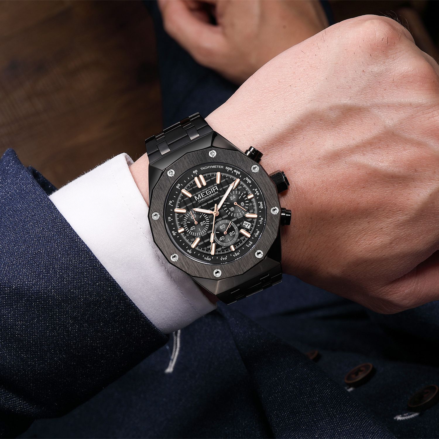 MEGIR 2213 men's chronograph watch on the wrist, black case with rose-gold accents, black dial and steel bracelet