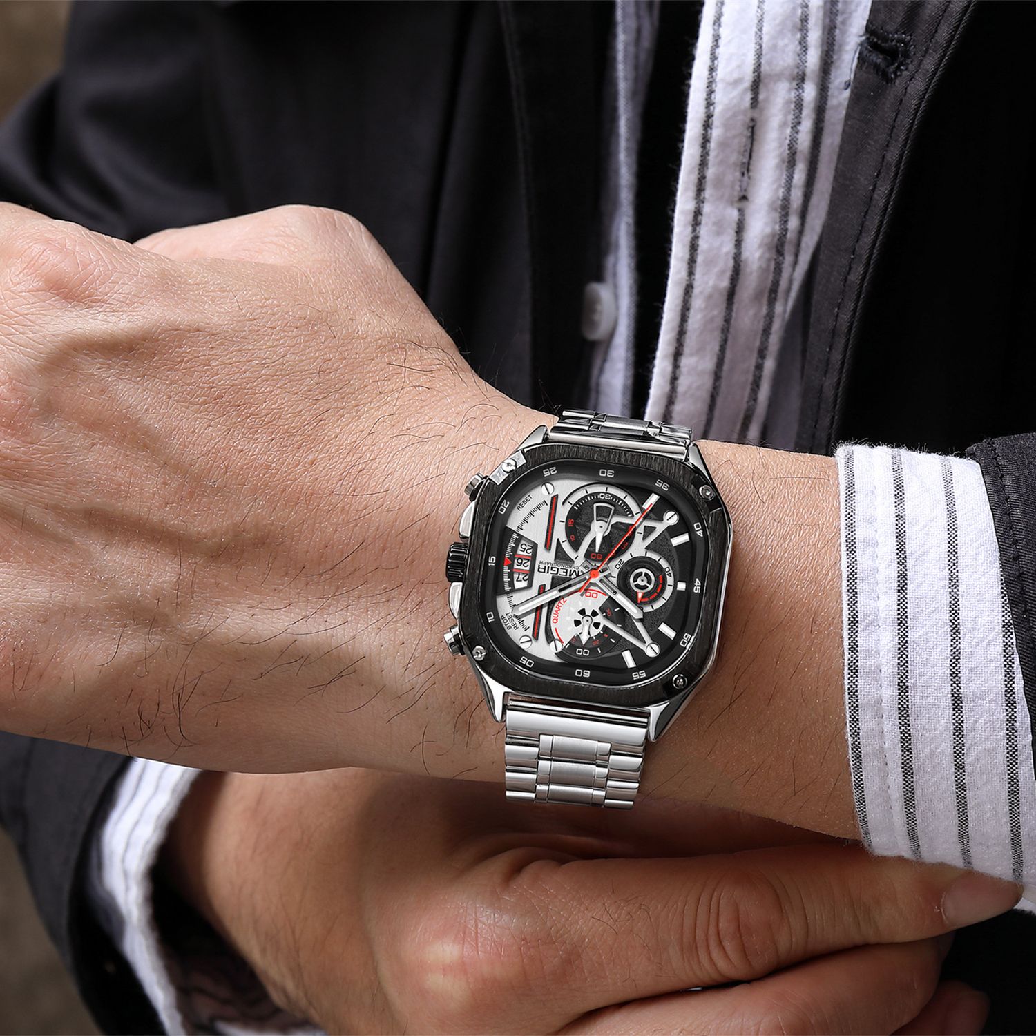 MEGIR 2217 men's chronograph watch on the wrist, silver case with white-black skeleton dial and steel bracelet