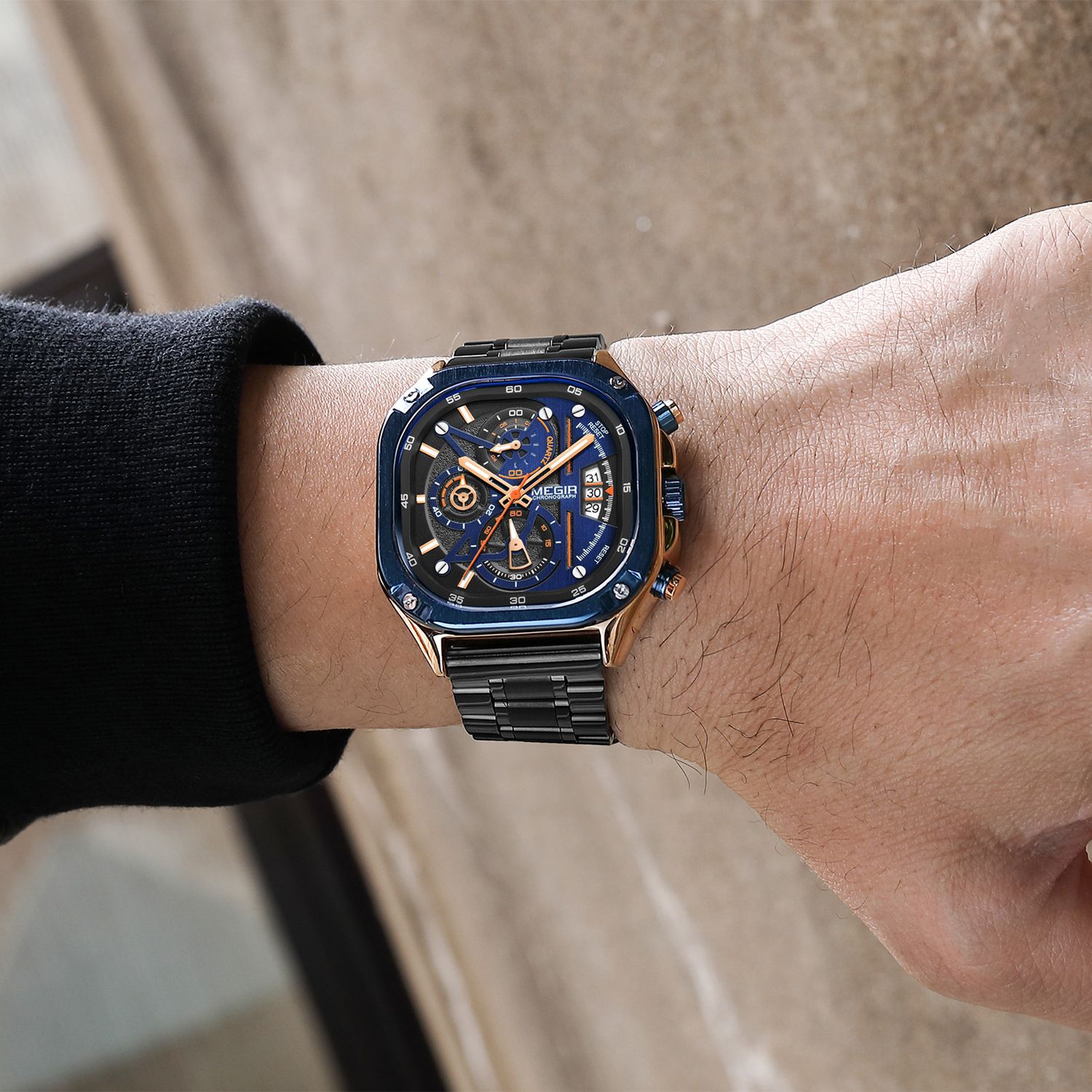 MEGIR 2217 men's chronograph watch on the wrist, blue bezel with rose-gold accents, blue dial and black bracelet