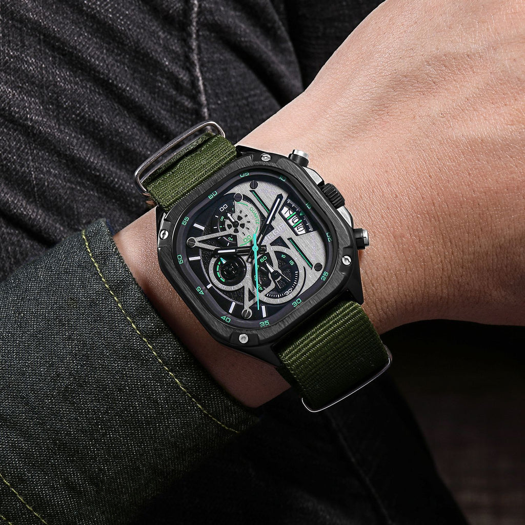 MEGIR 2217 men's chronograph watch on the wrist, black case with green-accent dial and green canvas strap