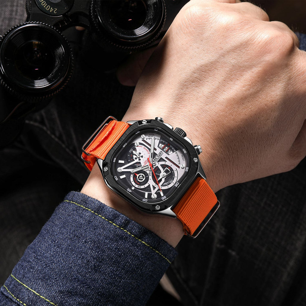 MEGIR 2217 men's chronograph watch on the wrist, black case with white-black dial and orange canvas strap