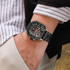 MEGIR 2217 men's chronograph watch on the wrist, black case with rose-gold bezel, red-accent dial and black bracelet