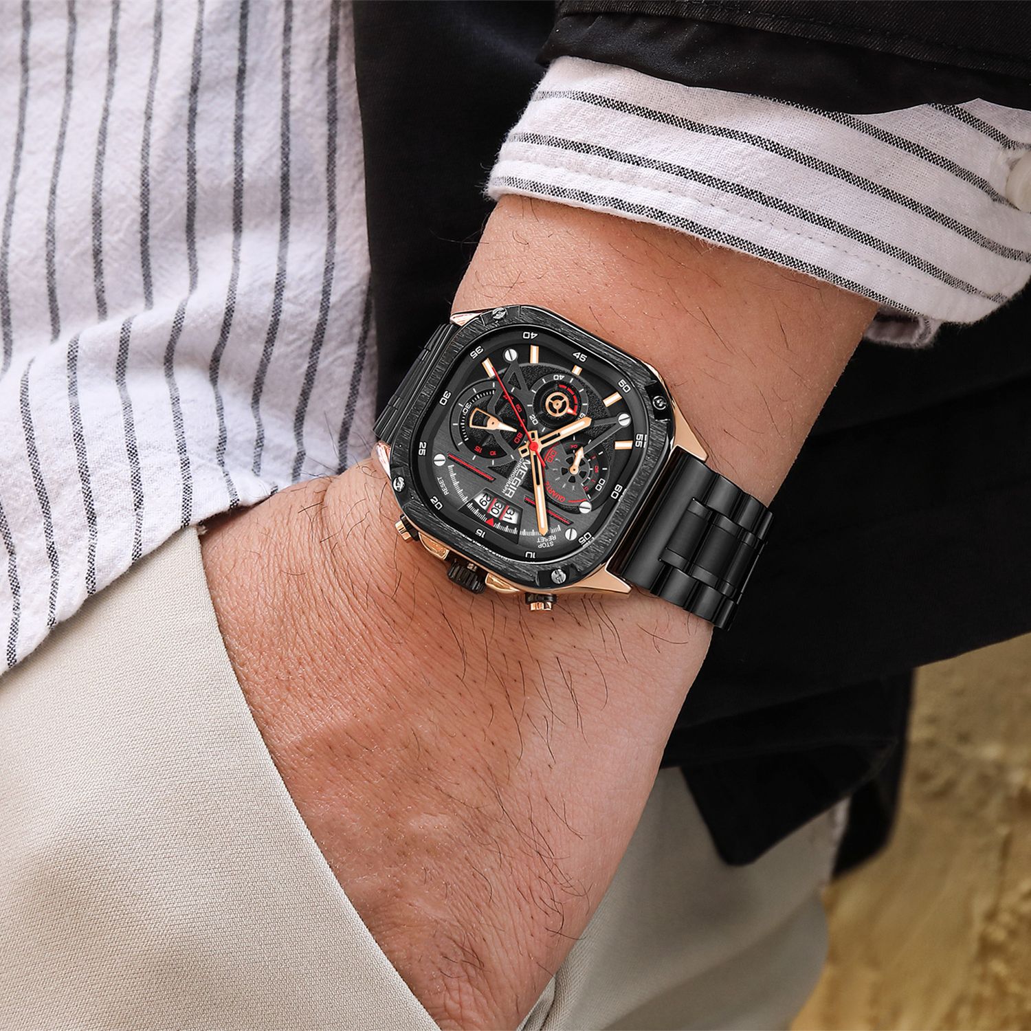 MEGIR 2217 men's chronograph watch on the wrist, black case with rose-gold bezel, red-accent dial and black bracelet