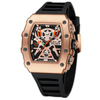 MEGIR 2218 men's skeleton watch, rose-gold case with orange-accent skeleton dial and black silicone strap, studio view