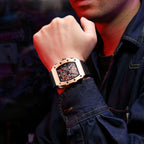 MEGIR 2218 men's skeleton watch on the wrist, rose-gold case with skeleton dial and black silicone strap