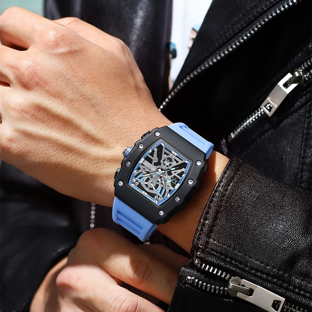 MEGIR 2218 men's skeleton watch on the wrist, black case with blue-accent skeleton dial and blue silicone strap