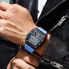 MEGIR 2218 men's skeleton watch on the wrist, black case with blue-accent skeleton dial and blue silicone strap