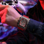 MEGIR 2218 men's skeleton watch on the wrist, black case with red-accent skeleton dial and red silicone strap