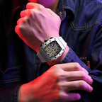 MEGIR 2218 men's skeleton watch on the wrist, silver case with yellow-accent skeleton dial and white silicone strap