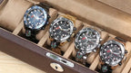 MEGIR 2219 men's chronograph watches in a display case showing blue, gold, silver and rose-gold colorways