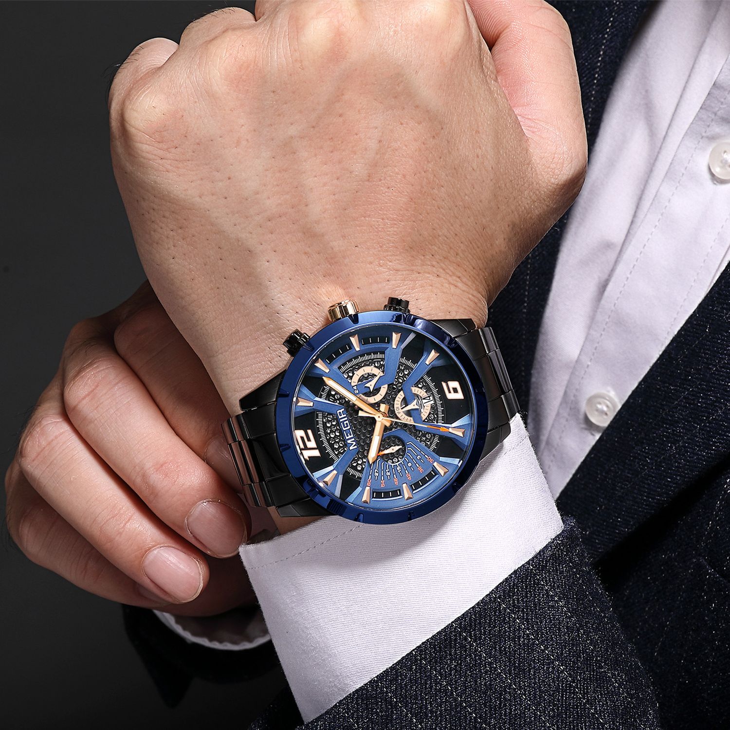 MEGIR 2221 men's chronograph watch on the wrist, blue bezel with rose-gold accents, dark skeleton dial and black bracelet