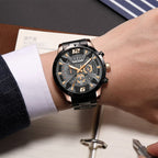 MEGIR 2221 men's chronograph watch on the wrist, black case with rose-gold accents, skeleton dial and black bracelet