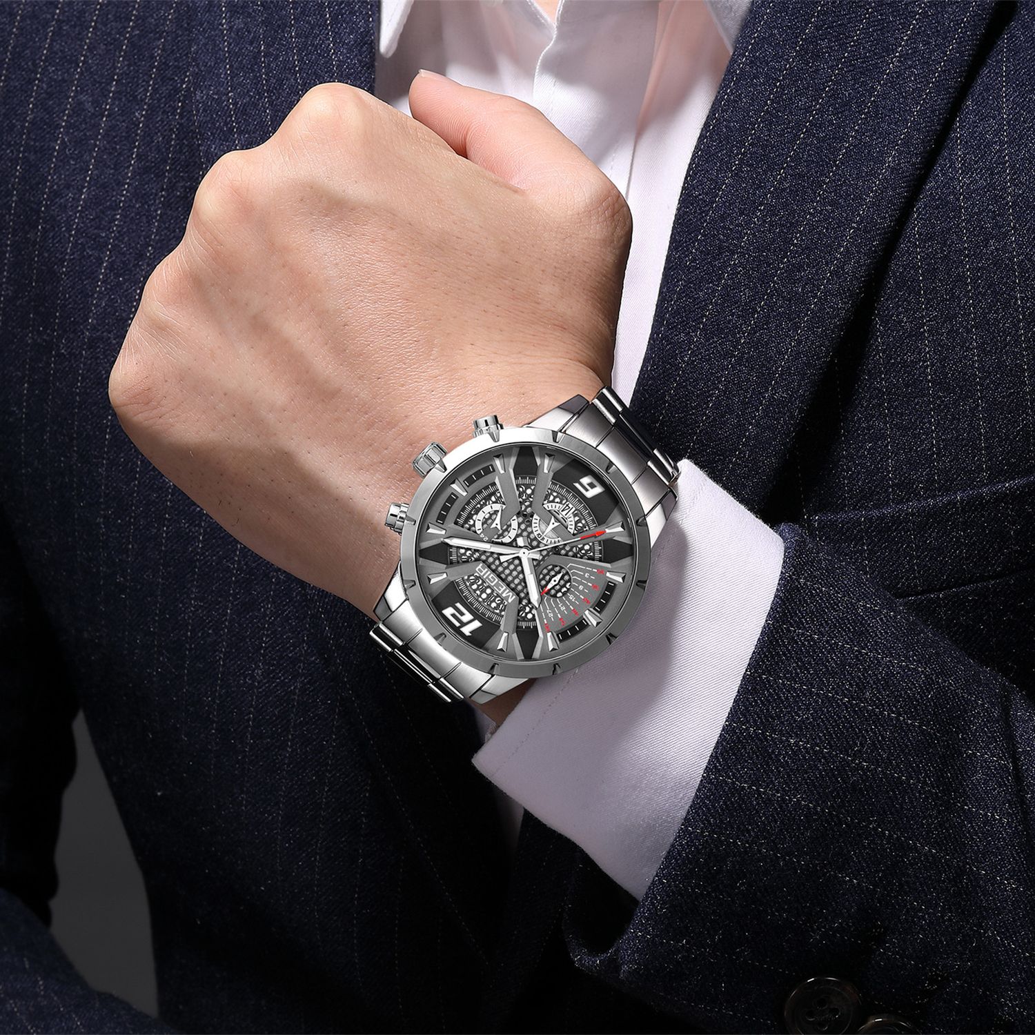 MEGIR 2221 men's chronograph watch on the wrist, silver case with gray-black skeleton dial and steel bracelet