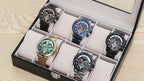 MEGIR 2223 men's chronograph watches in a display case showing gold, blue, black and rose-gold colorways