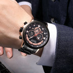 MEGIR 2223 men's chronograph watch on the wrist, black case with rose-gold accents, black dial and black bracelet