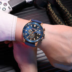 MEGIR 2224 men's chronograph watch on the wrist, rose-gold case with blue dial and blue silicone strap