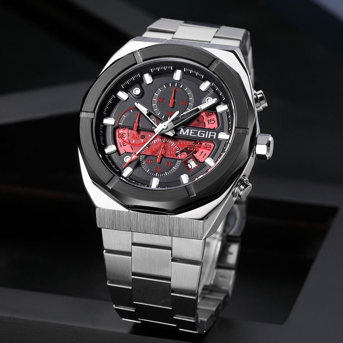 MEGIR 2225 men's chronograph watch, silver octagonal case with black dial, red accents and steel bracelet, angled view