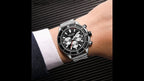 MEGIR 2226 men's chronograph watch on the wrist, silver case with black dial and steel bracelet, side angle