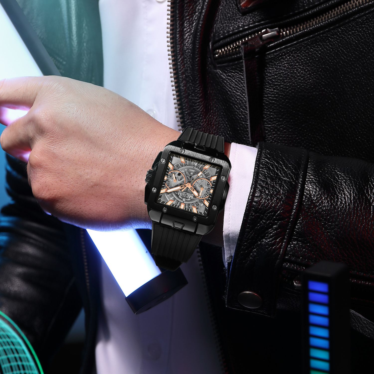 MEGIR 2228 men's chronograph watch on the wrist, black square case with skeleton dial and black silicone strap