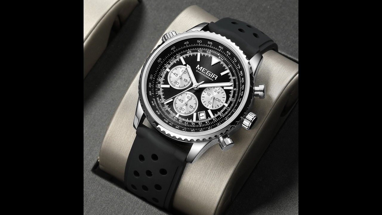MEGIR 2236 men's chronograph watch, silver case with black dial and black silicone strap, styled on a stand
