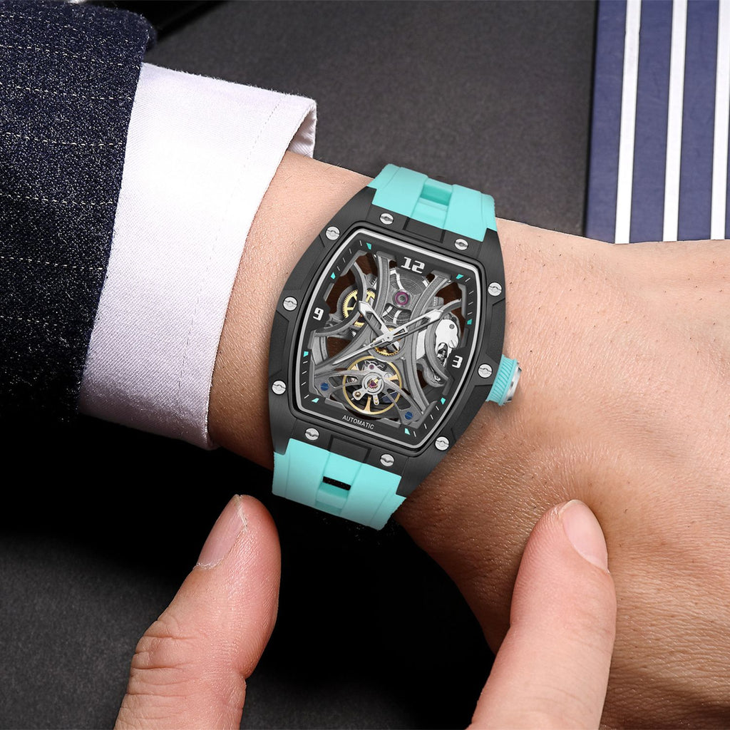 MEGIR 2245 men's skeleton automatic watch on the wrist, black tonneau case with open dial and light blue strap