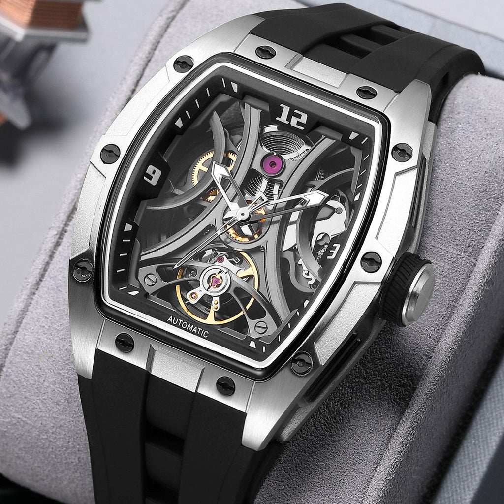 MEGIR 2245 men's skeleton automatic watch, silver tonneau case with open dial and black silicone strap, angled view