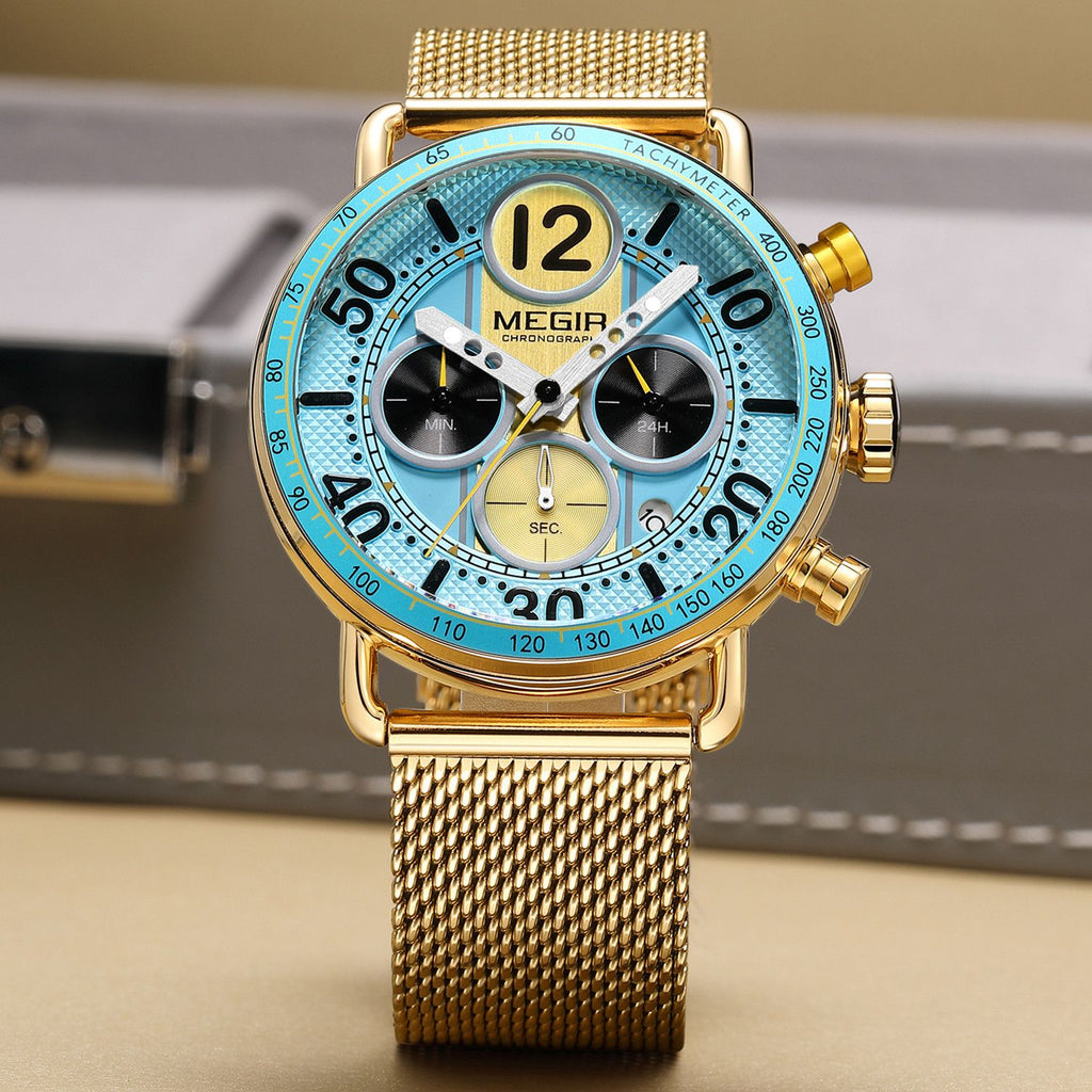 MEGIR 2249 men's chronograph watch, gold-tone case with light blue dial, tachymeter bezel and gold mesh bracelet, angled view