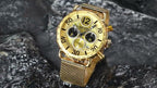 MEGIR 2249 men's chronograph watch, gold-tone case with gold dial and gold mesh bracelet, styled on stone