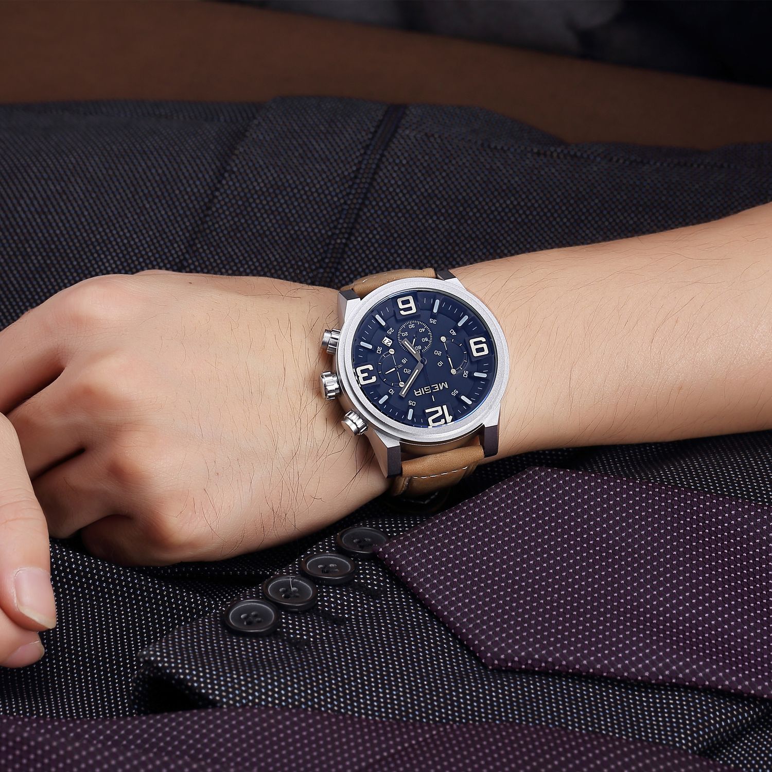 MEGIR 3010 men's chronograph watch on the wrist, silver case with blue dial and brown leather strap