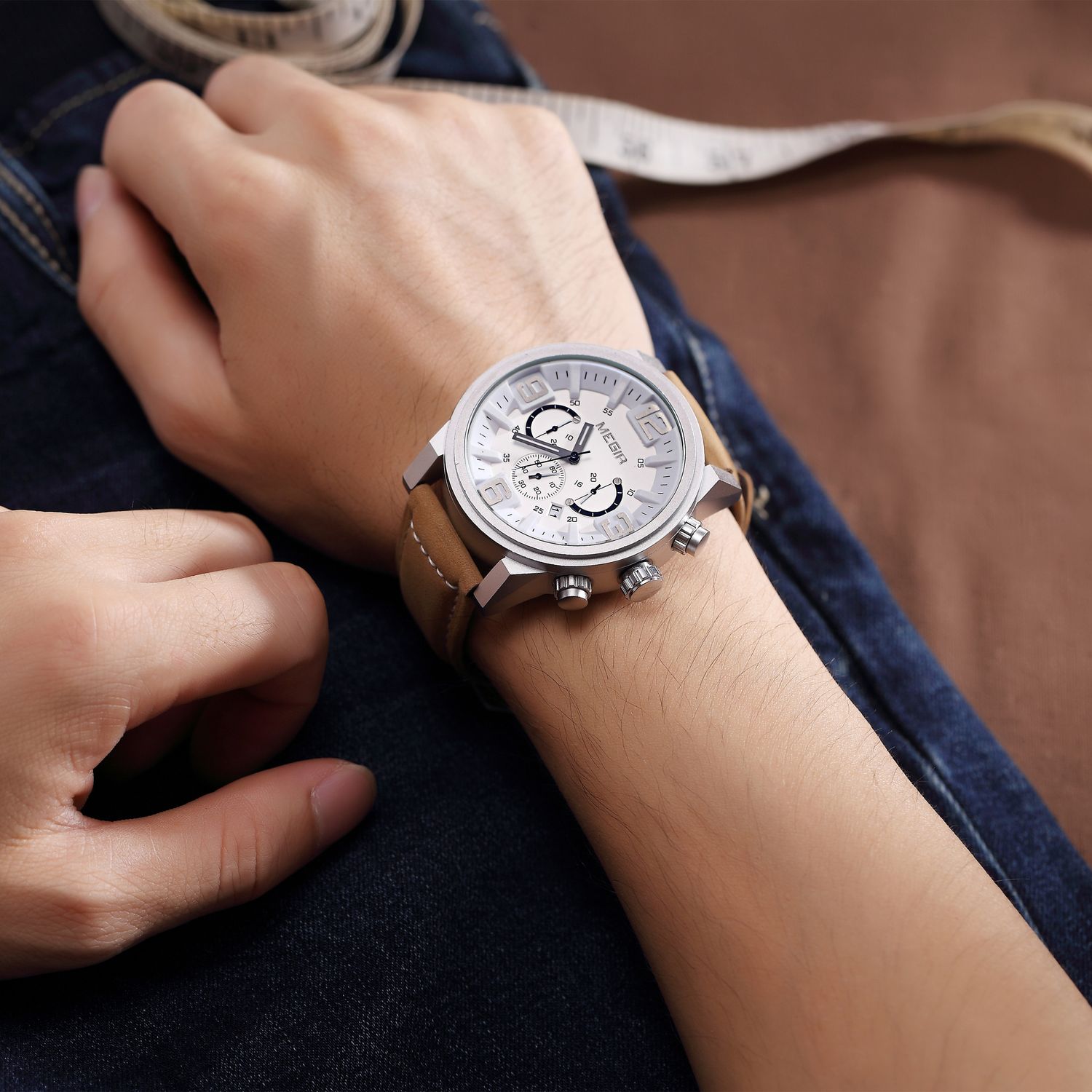 MEGIR 3010 men's chronograph watch on the wrist, silver case with white dial and brown leather strap