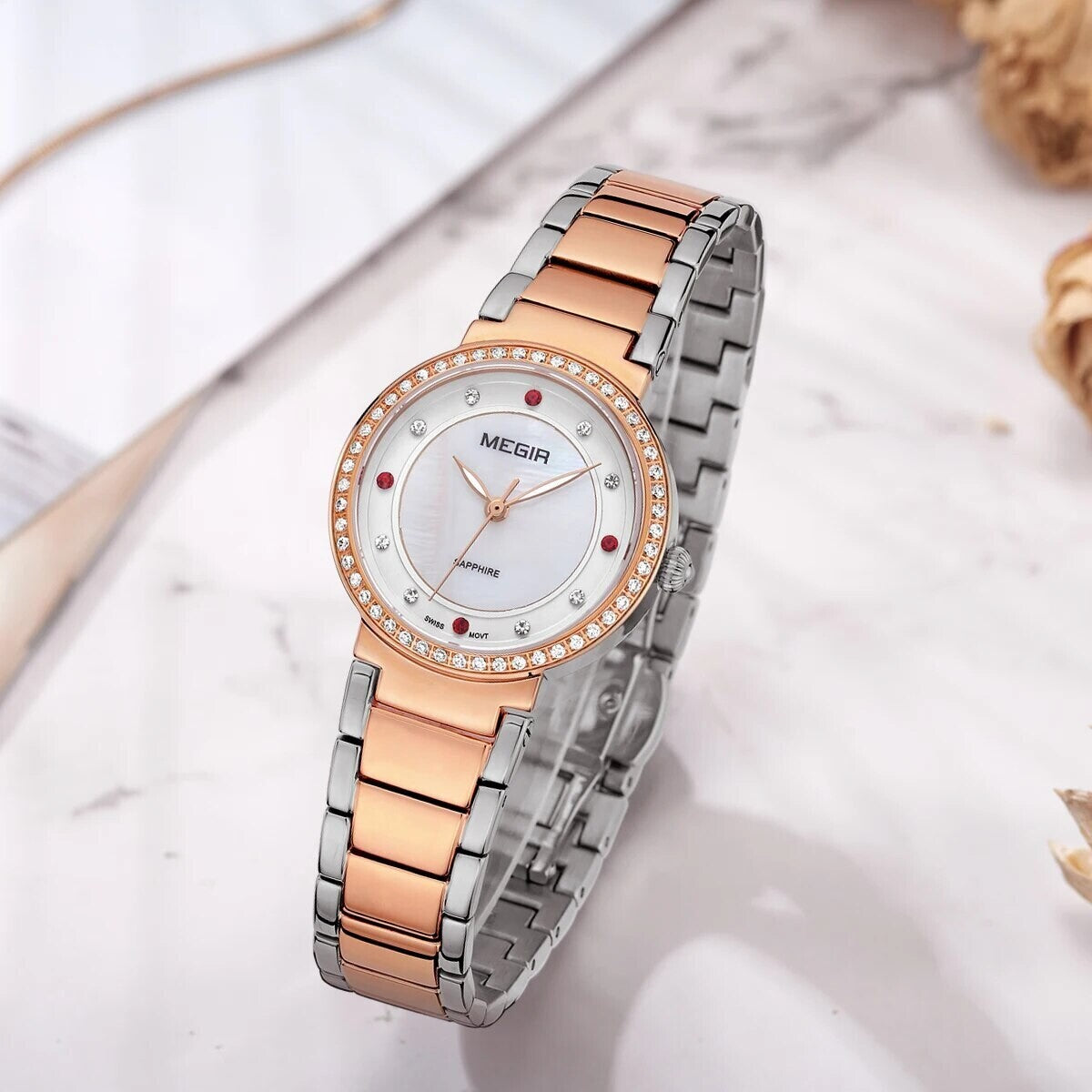MEGIR 4164 women's quartz watch, rose-gold case and two-tone bracelet with mother-of-pearl dial, angled view