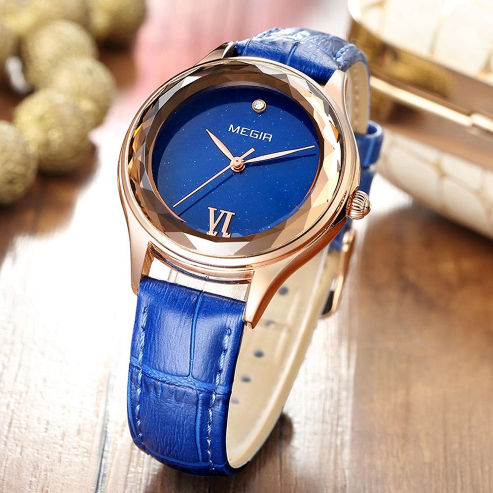 MEGIR 4208 women's quartz watch, rose-gold faceted case with blue starry dial and blue leather strap, angled view
