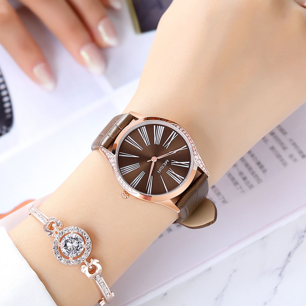 MEGIR 4212 women's quartz watch on the wrist, rose-gold case with brown Roman-numeral dial and brown strap