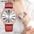MEGIR 4212 women's quartz watch on the wrist, rose-gold case with white dial and red leather strap
