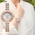 MEGIR 4219 women's quartz watch on the wrist, rose-gold case and crystal-set bracelet with white dial
