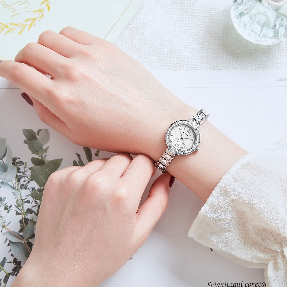 MEGIR 4219 women's quartz watch on the wrist, silver case and crystal-set bracelet with white dial