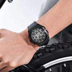 MEGIR 4220 men's chronograph watch on the wrist, black case with grey skeleton dial and black leather strap