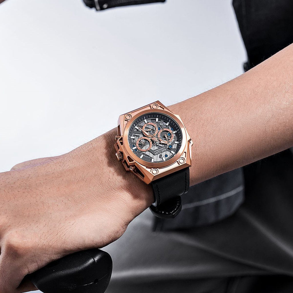 MEGIR 4220 men's chronograph watch on the wrist, rose-gold case with grey skeleton dial and black leather strap
