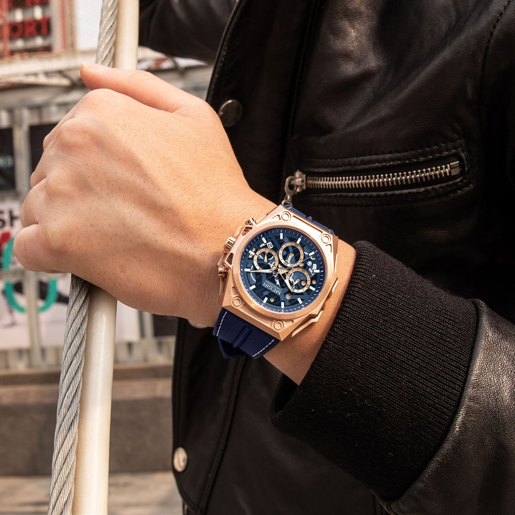 MEGIR 4220 men's chronograph watch on the wrist, rose-gold case with blue skeleton dial and blue silicone strap