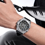 MEGIR 4220 men's chronograph watch on the wrist, silver case with grey skeleton dial and black leather strap