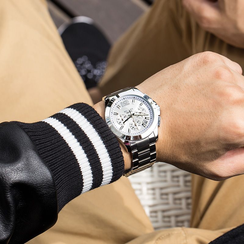 MEGIR 5006 men's chronograph watch on the wrist, silver case and bracelet with white dial, outdoors