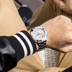MEGIR 5006 men's chronograph watch on the wrist, silver case and bracelet with white dial, outdoors